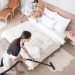 Picture of workers cleaning a hotel room.