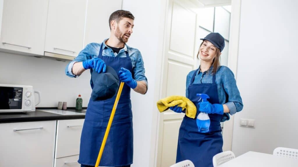 Picture of two people cleaning a house